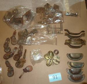 Group of vintage furniture hardware, drawer pulls, keyhole covers, wheels
