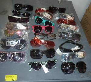 23 new pair of adult sunglasses