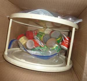 Box with a spice carousel, spices and spray bottles