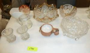 Group of pressed glass bowls and candle holders, a ceramic shell planter and a clay cow ash tray
