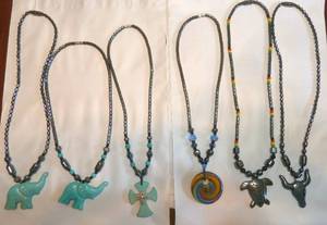 Group of 6 hematite necklaces with carved stone figures