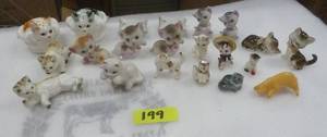 A bunch of small kitten figures, the whole back row are salt and pepper shakers