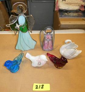 Group of glass birds and stained glass angels