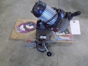 lot 231 image: Chainsaw sharpener with extra grinding wheels