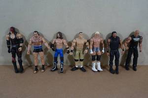 lot 106 image: Large Wrestling Action Figures - Rock, Cena