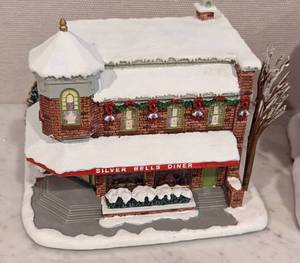 lot 200 image: Pair of Norman Rockwell Hawthorn Christmas Villages