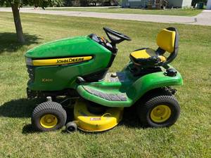 lot 85 image: John Deere X300 Tractor with Bagger