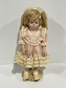 lot 3 image: Porcelain Doll with Stand