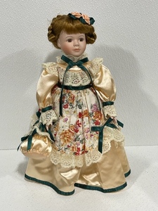 lot 4 image: Porcelain Doll with Stand