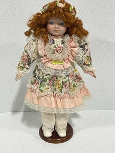 lot 7 image: Porcelain Doll with Stand