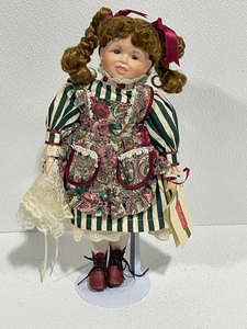 lot 11 image: House of Lloyd Christmas Around the World Porcelain Doll