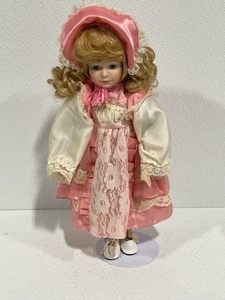 lot 10 image: Porcelain Doll with Stand
