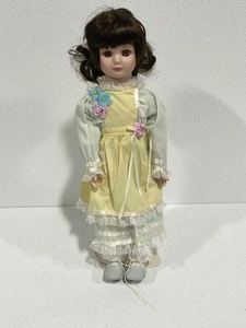 lot 18 image: Porcelain Doll with Stand