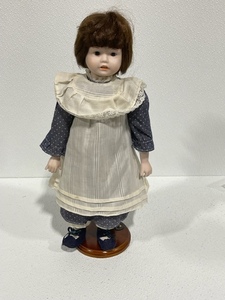 lot 19 image: Porcelain Doll with Stand