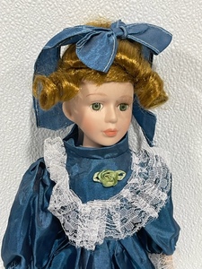 lot 20 image: Porcelain Doll with Stand