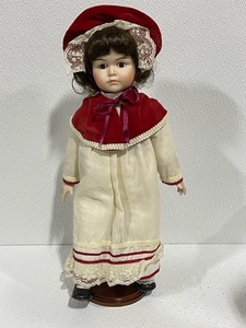 lot 22 image: Porcelain Doll with Stand