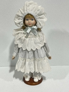 lot 15 image: Porcelain Doll with Stand
