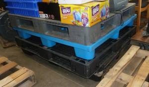 lot 19 image: 4 Plastic pallets (none of the contents on top are included)