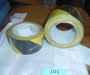 lot 101 image: 2 rolls of YellowBlack vinyl tape, 3in and 2 in