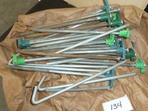 lot 134 image: Group of tent stakes and big nails