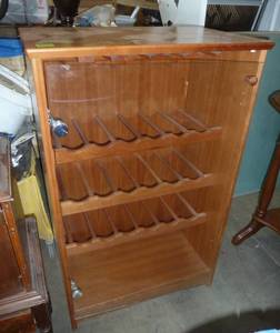 lot 136 image: Wood Wine cabinet 15x24x38 tall, bottom hinge needs to be screwed in or replaced, top has some bubbling