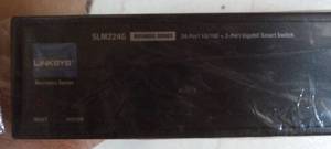 lot 161 image: New Linksys SLM224G gigabit smart switch 24 port 10100