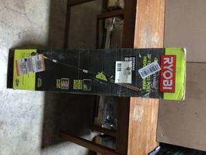 lot 27 image: 40V 18 in. Cordless Battery Pole Hedge Trimmer with 2.0 Ah Battery and Charger by RYOBI Customer Returns See Terms on Auction