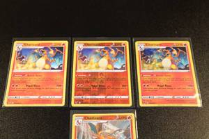 lot 87 image: Pokemon Vivid Voltage Charizard Rainbow w Pokemon GO Reverse Holo Lot  4 Cards