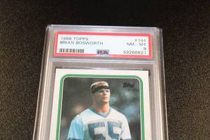 lot 155 image: 1988 Topps Brian Bosworth #144 Rookie Card PSA 8