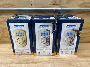 lot 110 image: SCHLAGE Lot of 3- Camelot Keypad Deadbolts (2 in Satin Nickel and 1 in Bright Brass)