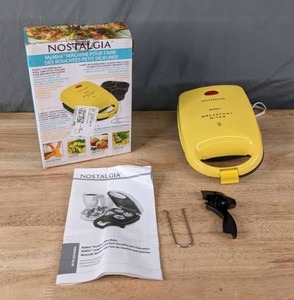 lot 148 image: Nostalgia MyMini Personal Nonstick Breakfast Bites Maker - Yellow