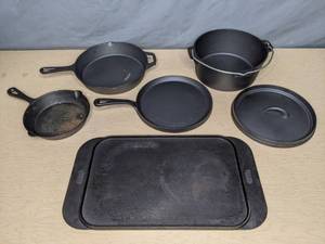 lot 56 image: MegaChef 5-Pc. Pre-Seasoned Cast Iron Cookware Set and Serving Tray