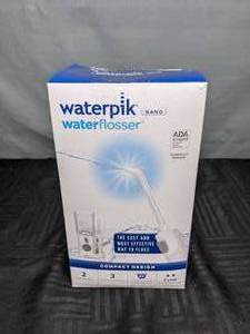 lot 313 image: Waterpik Nano Water Flosser