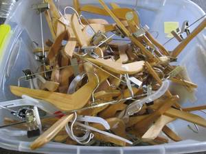 lot 70 image: tote of wood and plastic hangers...