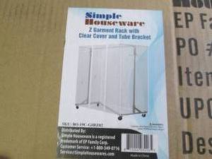 lot 97 image: garment rack with clear cover and t...