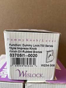 lot 5 image: Weslock Elegance Oil Rubbed Bronze Woodward Half-Dummy Impresa Door Knob (3 units)