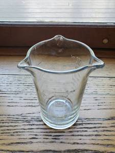 lot 165 image: Vintage Anchor Hawking measuring glass