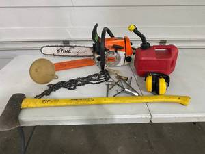 lot 50 image: Stihl 026 Chainsaw, Gas Can, 3 Extra Chains, Fiberglass Handle Axe, Ear Protection