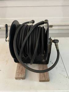 lot 77 image: Power Washer Hose on Reel