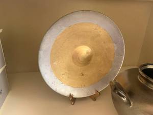 lot 19 image: Large reverse painted glass platter with stand and bronze look pottery vessel
