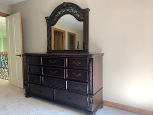 lot 30 image: Dark Wood Dresser with Mirror and Eleven Drawers