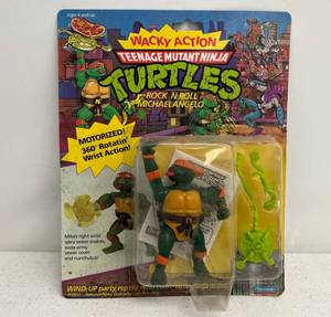 lot 40 image: 1989 TMNT Rock N Roll Michaelangelo On Original Card