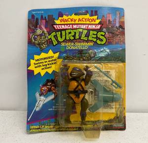 lot 41 image: 1989 TMNT Sewer Swimmin Donatello On Original Card
