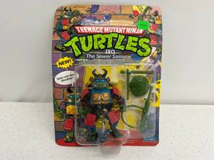 lot 43 image: 1990 TMNT Leo The Sewer Samuri On Original Card