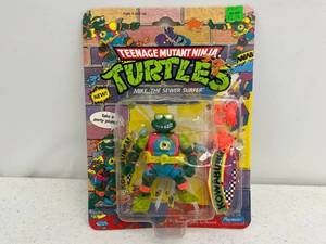 lot 44 image: 1990 TMNT Mike, The Sewer Surfer On Original Card