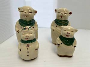 lot 112 image: Vintage Shawnee Smiley Shamrock Pig Large And Small Salt And Peppers