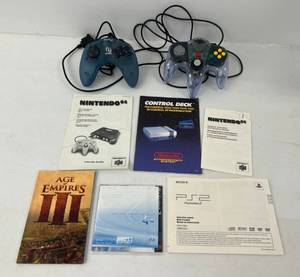 lot 164 image: Group Including Nes 64 Manuals ,PS2 And More