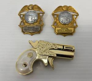 lot 171 image: Two Vintage Special Deputy Sheriff Badges And Derringer Lighter