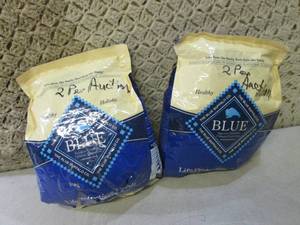 (C-3) 2 Damaged Bags Blue Dog Food...