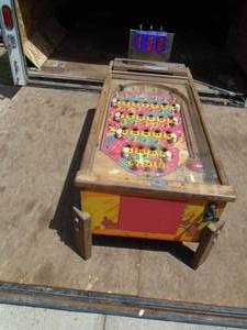 Pinball machine made into coffee table. Old wood machine. Looks like lights shouwl wire up. Nice shape for its age. 24 x 48. As shown.